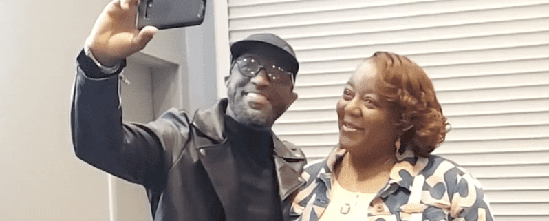 Man and woman taking a selfie together.